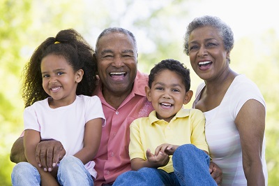 grandparents with their granddaugher and grandson