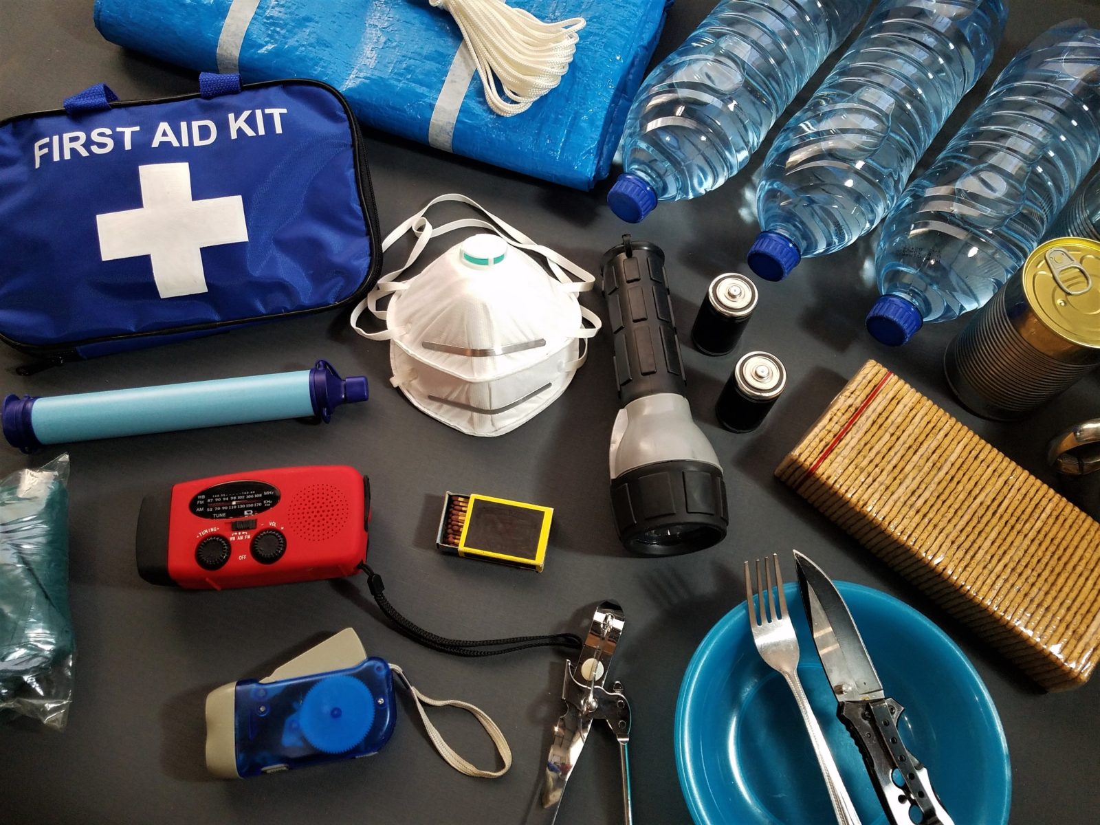 emergency preparedness kit with first aid flash light water bottles