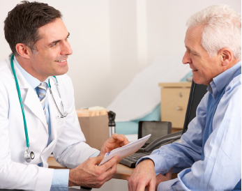 older adult man talking with male doctor in the doctor's office