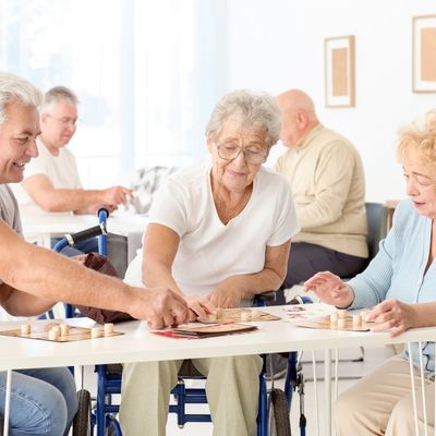 group of older adults playing Lotto in Assisted Living Facility