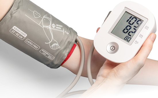 close up of persons hands holding blood pressure cuff