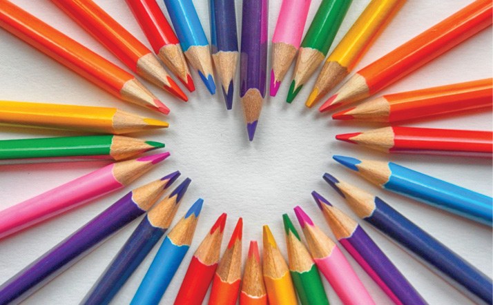 colored pencils arranged to make a heart shape
