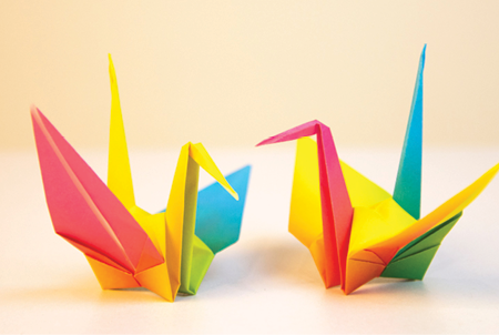 image of two colorful origami cranes